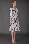 Favori Tekstil kruvaze yaka dijital baskı etek ucu piliseli kemer detaylı tasarım elbise